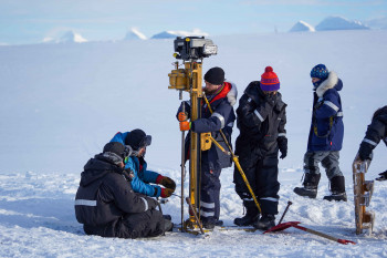 Thawing Arctic soil awakens only half of soil microbes, new study reveals Field team drilling to extract soil and permafrost samples from the tundra in Svalbard, during winter. Credit: James Bradley